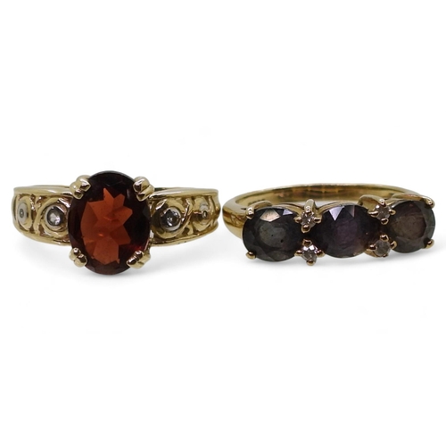 765 - A 9ct gold ring set with three purplish colour change gemstones and diamond accents, size N1/2, and ... 