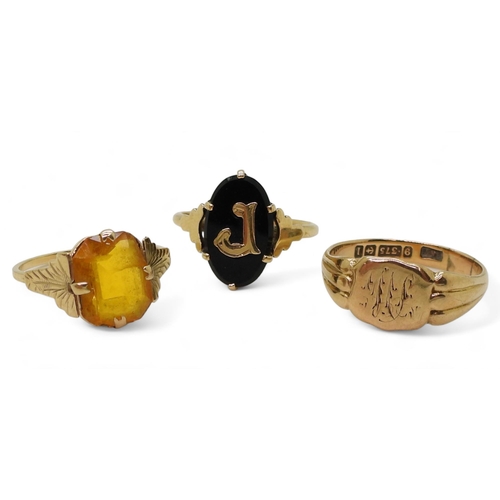 767 - Three 9ct gold rings, signet size Q, onyx signet size L1/2, and orange glass size M, weight together... 