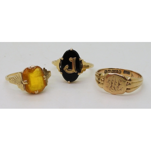 767 - Three 9ct gold rings, signet size Q, onyx signet size L1/2, and orange glass size M, weight together... 