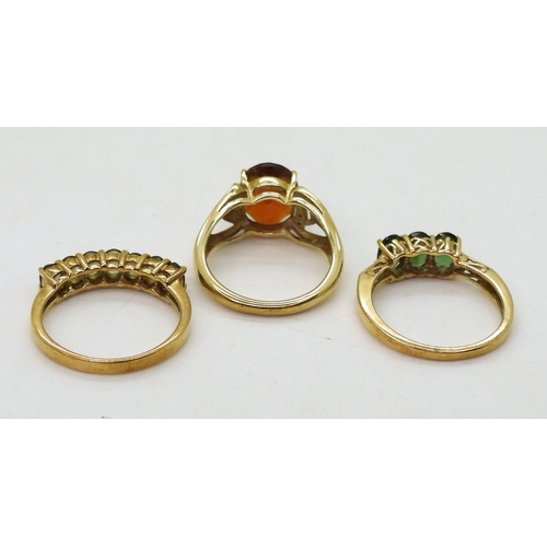 768 - A 9ct gold GemsTV, dark orange citrine and diamond ring, size N1/2, together with a three stone gree... 