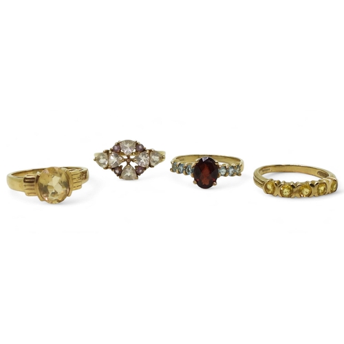 771 - Four 9ct gold gem set rings, clear and purple gem set ring, size N1/2, a yellow sapphire five stone ... 