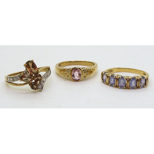 780 - A 9ct gold andalusite and diamond accent cluster ring, size N1/2, a 9ct pink sapphire and diamond ri... 