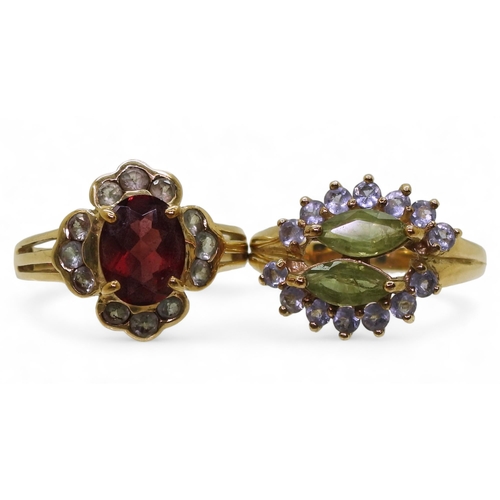 788 - A 9ct gold garnet and green gem cluster ring, size N1/2, and a peridot and purple gem ring, size N1/... 