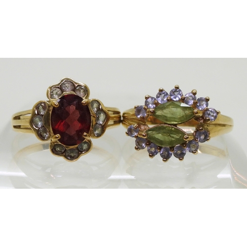 788 - A 9ct gold garnet and green gem cluster ring, size N1/2, and a peridot and purple gem ring, size N1/... 