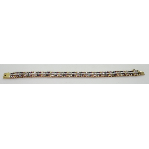 798 - A 9ct gold mixed colour sapphire bracelet with diamond accents, length 18.8cm, weight 20.5gms