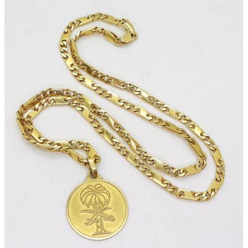 805 - An 18k gold Italian made pendant of the emblem of Saudi Arabia together with a 60cm 18ct gold fancy ... 