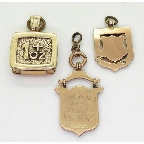 806 - Two 9ct gold medallions and a 9ct 'GOLD' charm, weight all together 43.8gms