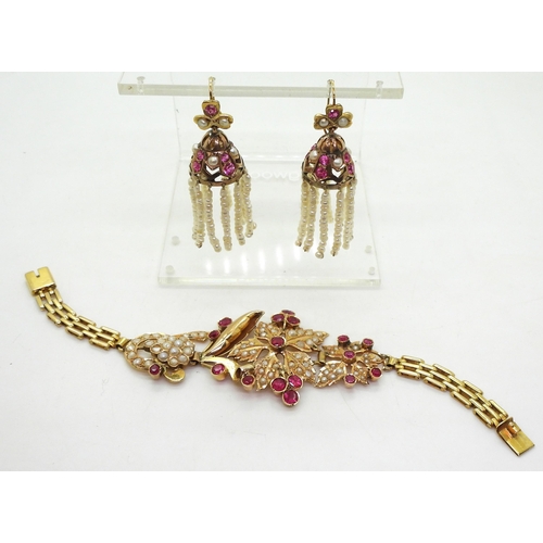 807 - A bright yellow metal Indian bracelet set with pearls and synthetic ruby gems, together with a pair ... 