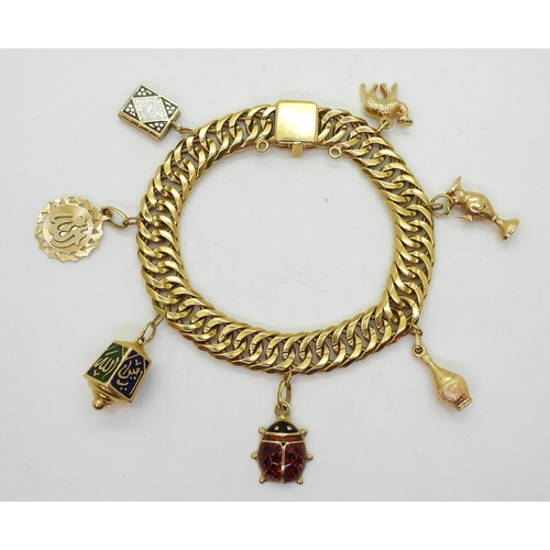 808 - An Arabic gold double curb chain bracelet, with Arabic gold marks to every link and the clasp, with ... 