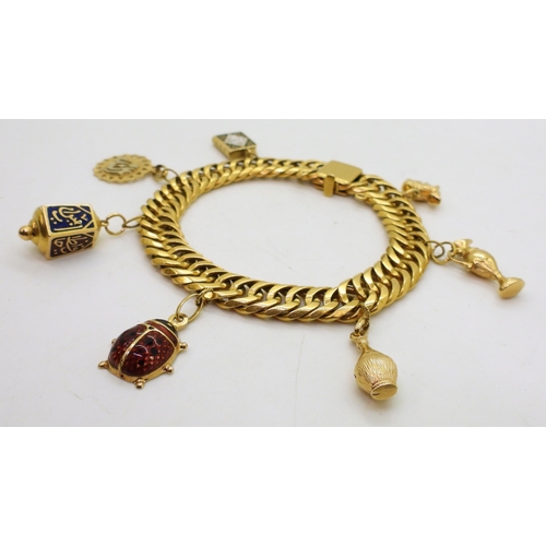 808 - An Arabic gold double curb chain bracelet, with Arabic gold marks to every link and the clasp, with ... 