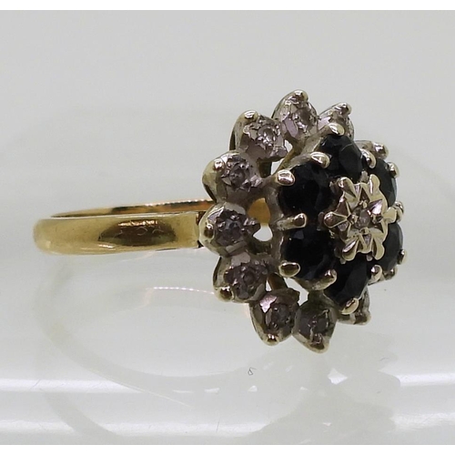 812 - A 9ct gold sapphire and diamond accent cluster ring, size N, weight 4gms