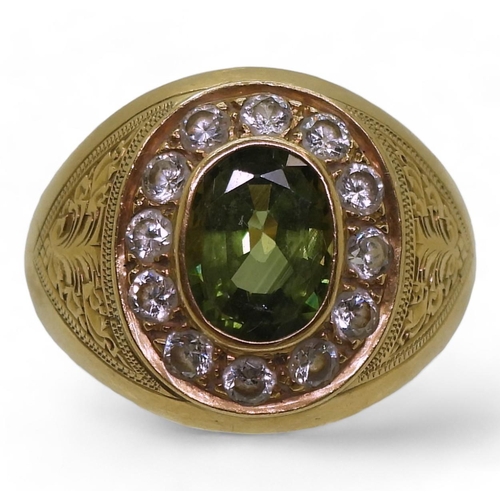 821 - A bright yellow metal ring stamped 90%, with engraved detail shoulders set with a green sapphire and... 