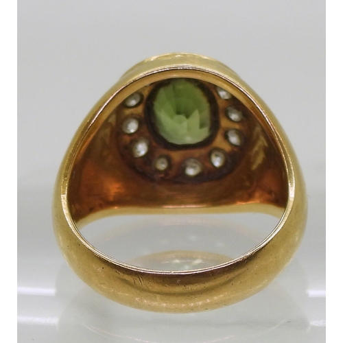 821 - A bright yellow metal ring stamped 90%, with engraved detail shoulders set with a green sapphire and... 