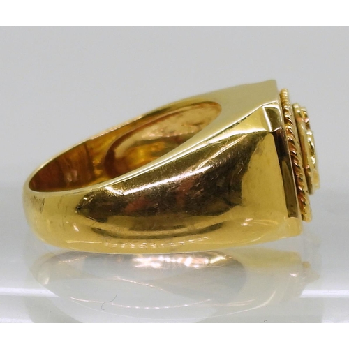 822 - A bright yellow metal ring stamped 18k set with a 0.07ct diamond , size Q, weight 12.1gms