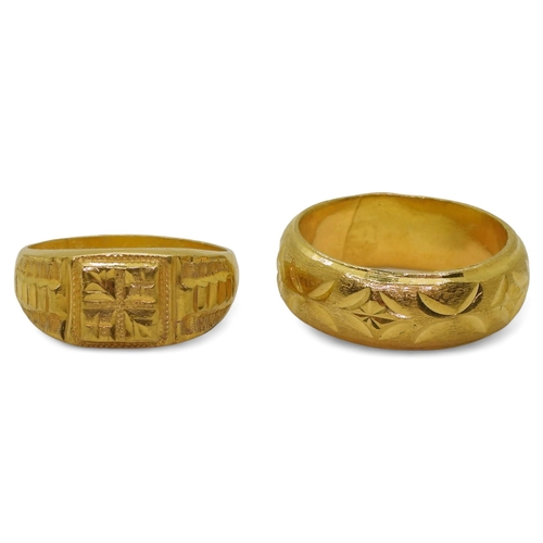 826 - Two bright yellow metal rings both stamped with Chinese characters the wedding ring stamped with a f... 