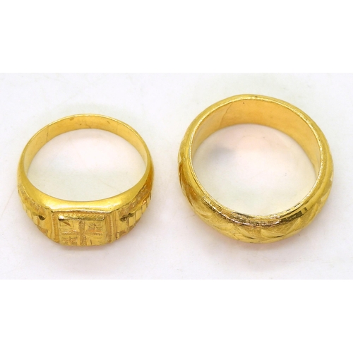 826 - Two bright yellow metal rings both stamped with Chinese characters the wedding ring stamped with a f... 