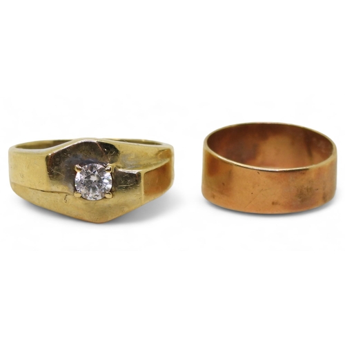 827 - A 9ct gold ring set with a clear gem, size V, and a yellow metal wedding ring, weight together 7.6gm... 