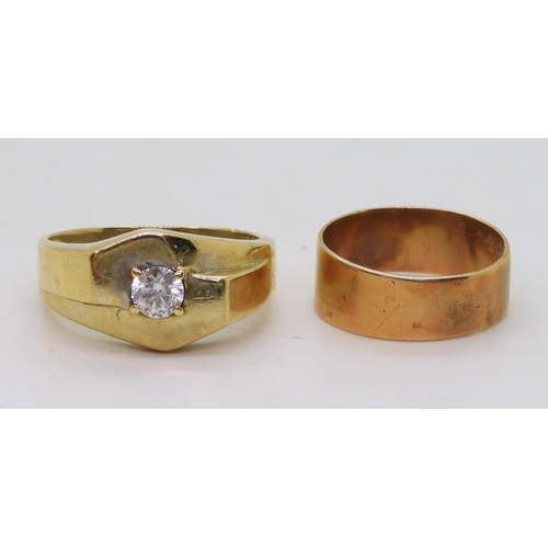 827 - A 9ct gold ring set with a clear gem, size V, and a yellow metal wedding ring, weight together 7.6gm... 