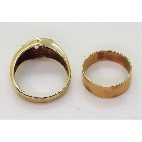 827 - A 9ct gold ring set with a clear gem, size V, and a yellow metal wedding ring, weight together 7.6gm... 