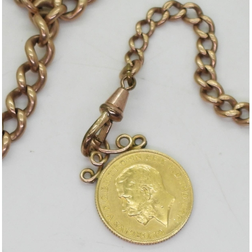 829 - A 9ct rose gold fob chain with attached 1913 full gold sovereign with soldered on yellow metal penda... 