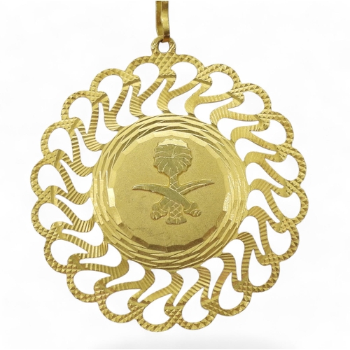 833 - An Italian made 21k gold pendant with the Emblem of Saudi Arabia, weight 13.2gms together with a bri... 