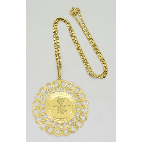 833 - An Italian made 21k gold pendant with the Emblem of Saudi Arabia, weight 13.2gms together with a bri... 