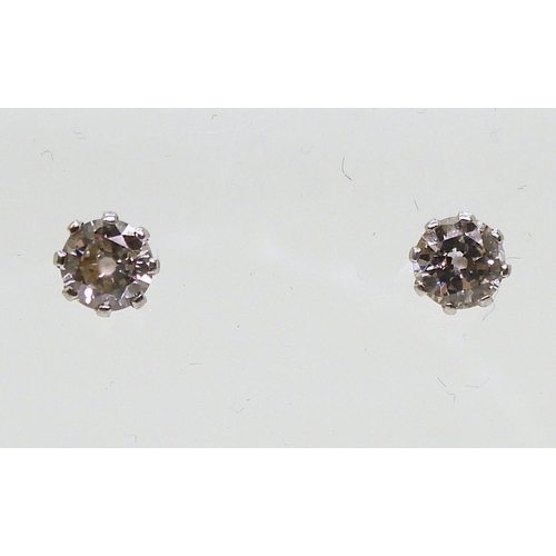 841 - A pair of 14k gold diamond stud earrings, set with estimated approx 0.30cts across the pair, weight ... 