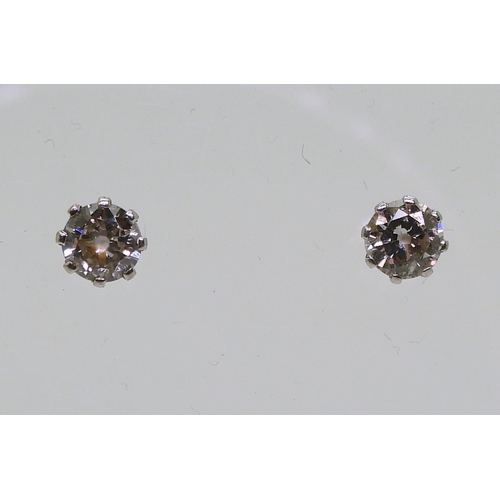 841 - A pair of 14k gold diamond stud earrings, set with estimated approx 0.30cts across the pair, weight ... 