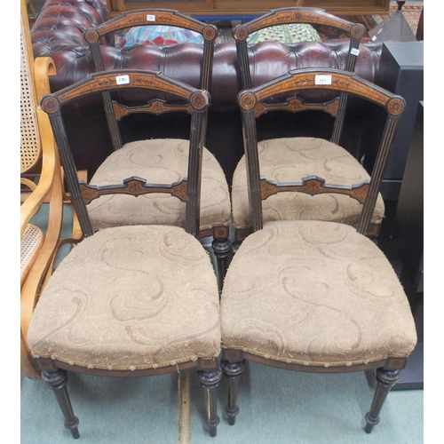 101 - A set of four Victorian ebonised parlour chairs with burr walnut inlaid frame on turned front suppor... 