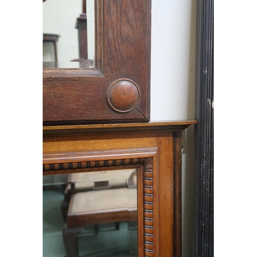 127 - A lot comprising a 20th century oak bevelled glass overmantle mirror, 88cm high x 108cm wide and ano... 