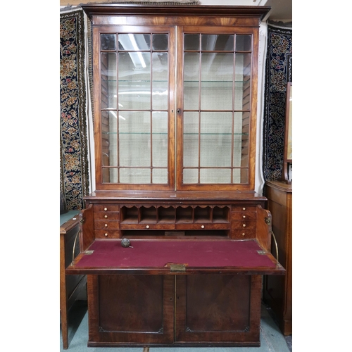 136 - A 19th century walnut veneered secretaire bookcase with moulded cornice over pair of beaded glazed d... 