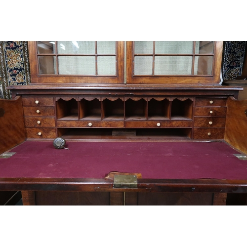 136 - A 19th century walnut veneered secretaire bookcase with moulded cornice over pair of beaded glazed d... 