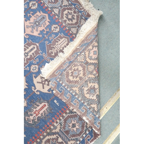 22 - A blue ground Turkish nomadic style rug with all over geometric patterned ground within multicoloure... 