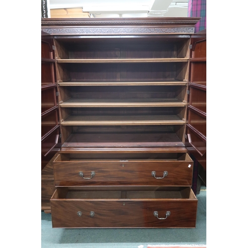 27 - A large 20th century mahogany veneered linen press/wardrobe with dentil cornice over two pairs of pa... 