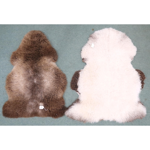 68 - A lot of two assorted sheep's skin rugs approximately 100cm long x 70cm wide (2)