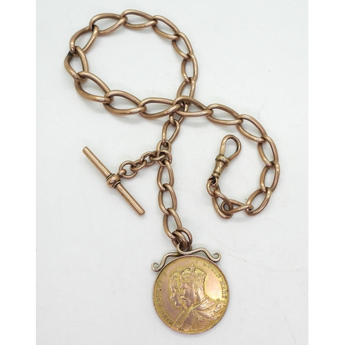 741 - A 9ct rose gold tapered elongated curb chain fob, length 32.5cm, with a George V, Coronation year Ag... 