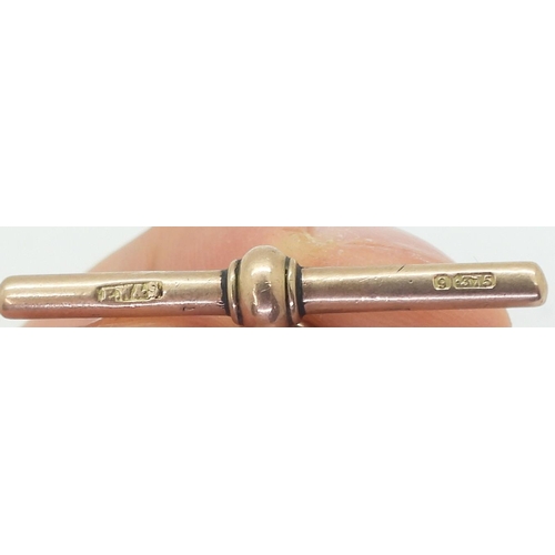 741 - A 9ct rose gold tapered elongated curb chain fob, length 32.5cm, with a George V, Coronation year Ag... 