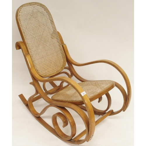 93 - A 20th century bentwood bergere rocking chair, 96cm high x 54cm wide x 97cm deep