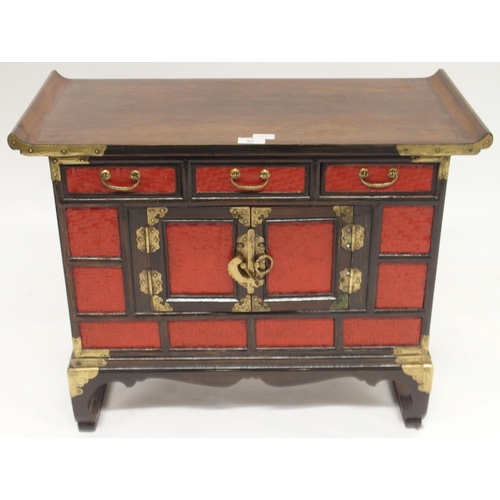 97 - A 20th century Oriental style hardwood countertop cabinet with three short drawers over central cabi... 