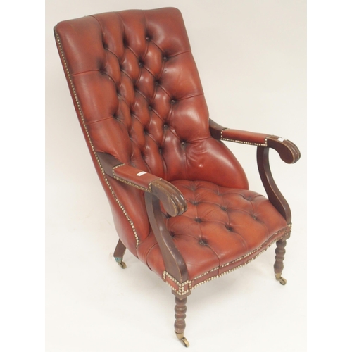 99 - A late 19th/early 20th century red leather buttonback upholstered library slipper chair on turned su... 