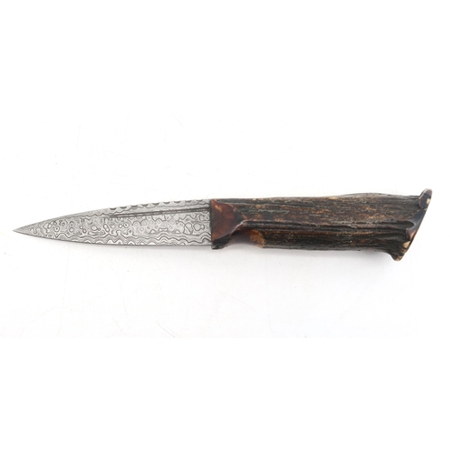 303A - A Sgian Dubh with Damascus steel blade and burnt antler handle, the blade measuring approx. 8.8cm in... 