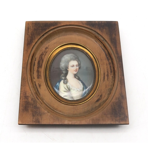 306 - A portrait miniature of a lady in 18th century dress, possibly signed 