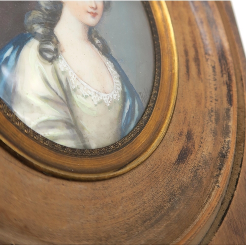 306 - A portrait miniature of a lady in 18th century dress, possibly signed 