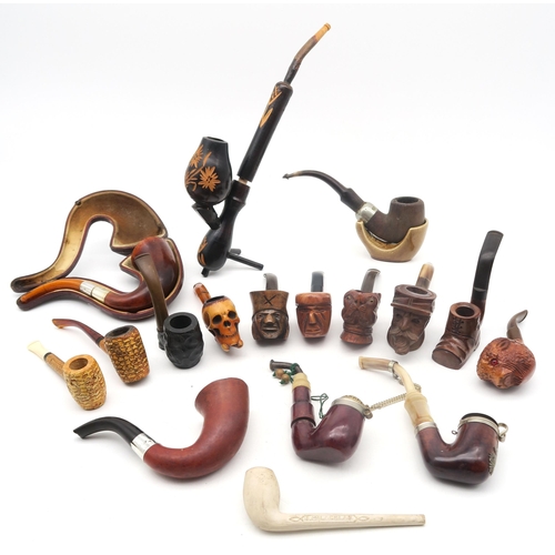 308 - A collection of smoker's pipes, to include a cased example with London silver collar and amber stem,... 