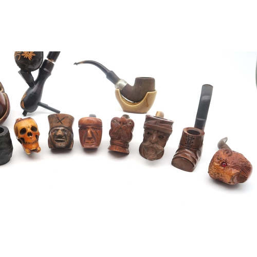 308 - A collection of smoker's pipes, to include a cased example with London silver collar and amber stem,... 