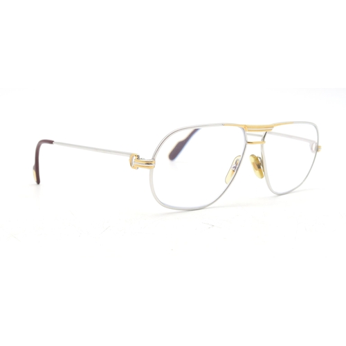 325 - A pair of Cartier glasses, dated 1988, numbered 59 14 to the bridge, the temples marked 