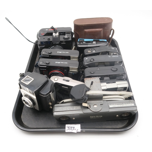 333 - A collection of vintage cameras, to  include a Revue S3 Super 8 camera, two Olympus DX cameras,... 