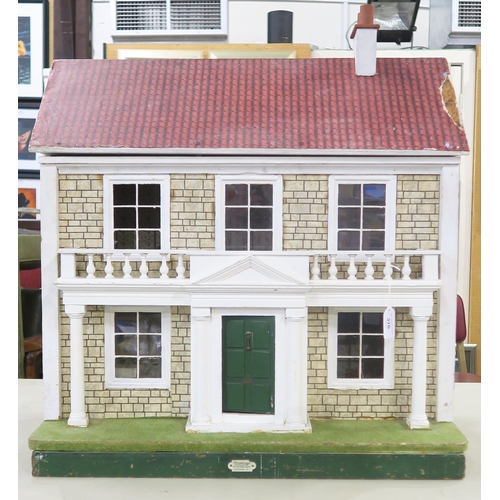 370 - A vintage Hamley's dolls' house, with porticoed front entrance, the hinged frontage opening to revea... 