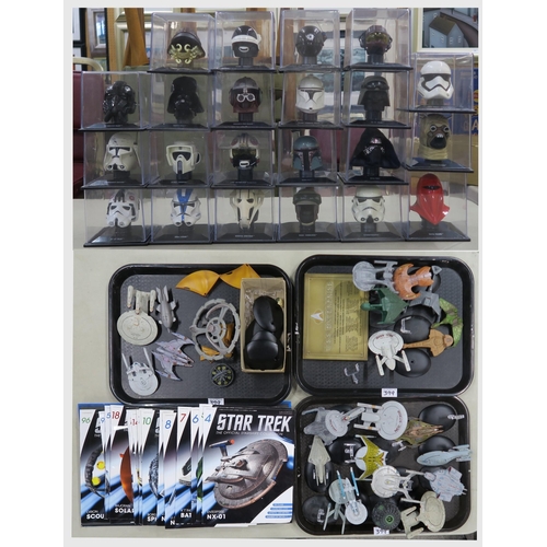 399 - The Star Wars Helmet Collection, produced by Deagostini: a quantity of miniature helmets in plastic ... 