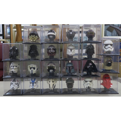 399 - The Star Wars Helmet Collection, produced by Deagostini: a quantity of miniature helmets in plastic ... 